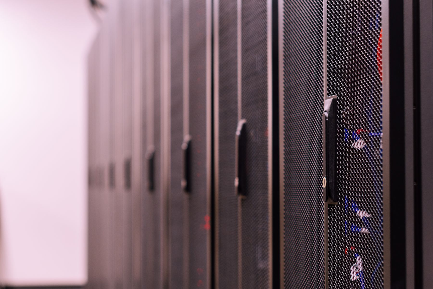 Row of enclosed server racks in a data center