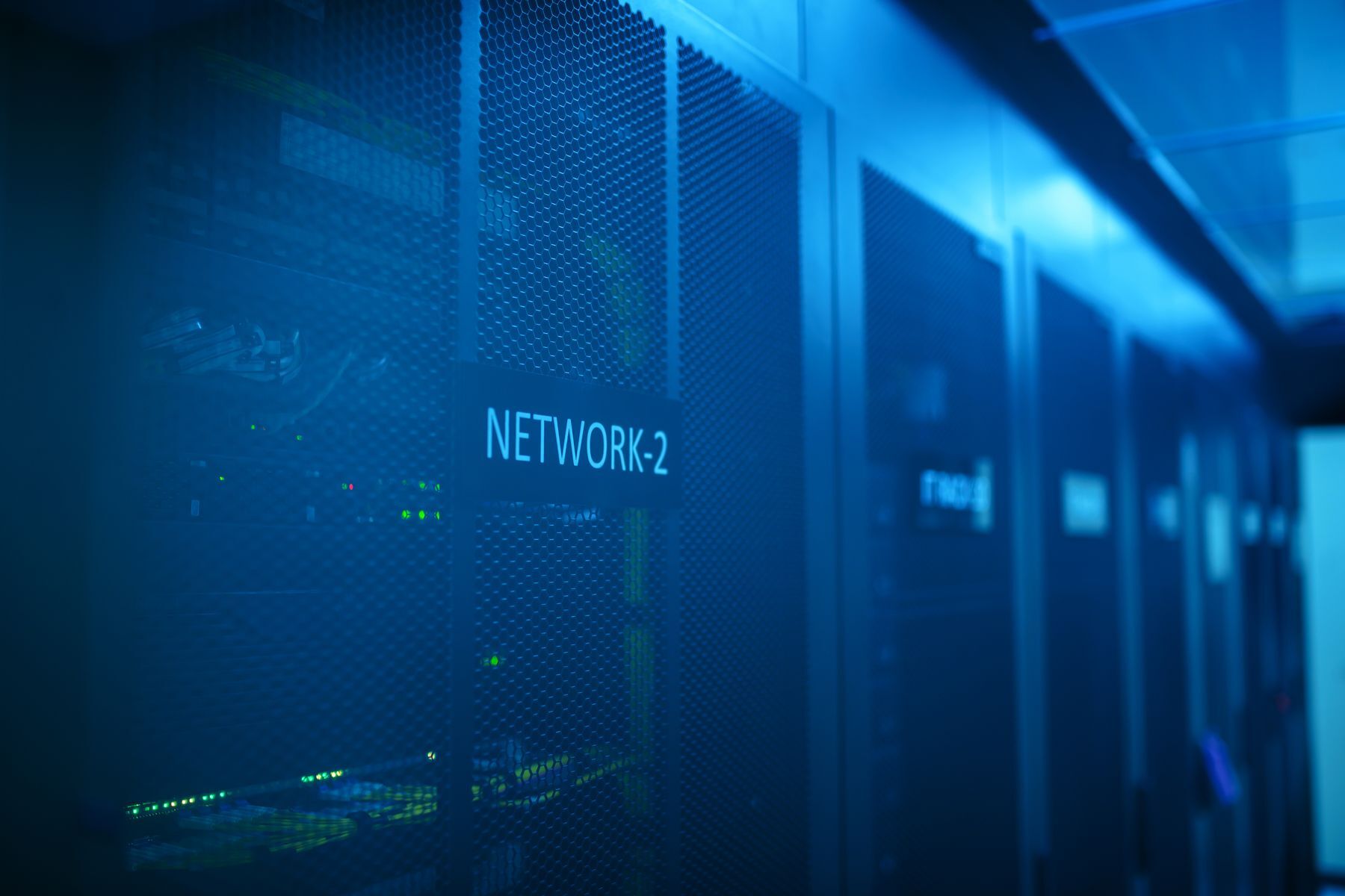 Blue-lit server cabinets in a data center